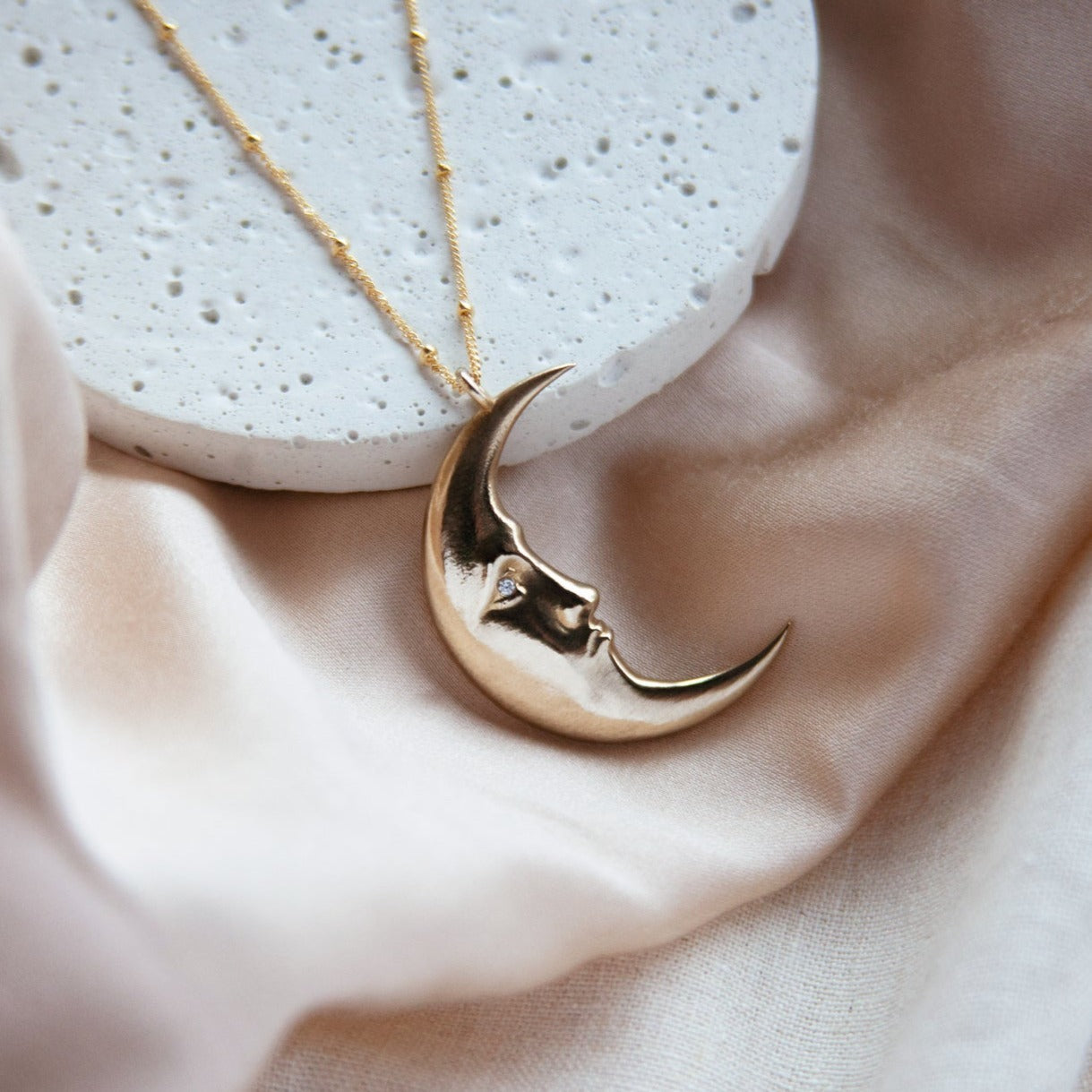 Large Nocturne Necklace in brass with clear CZ stone set in eyes