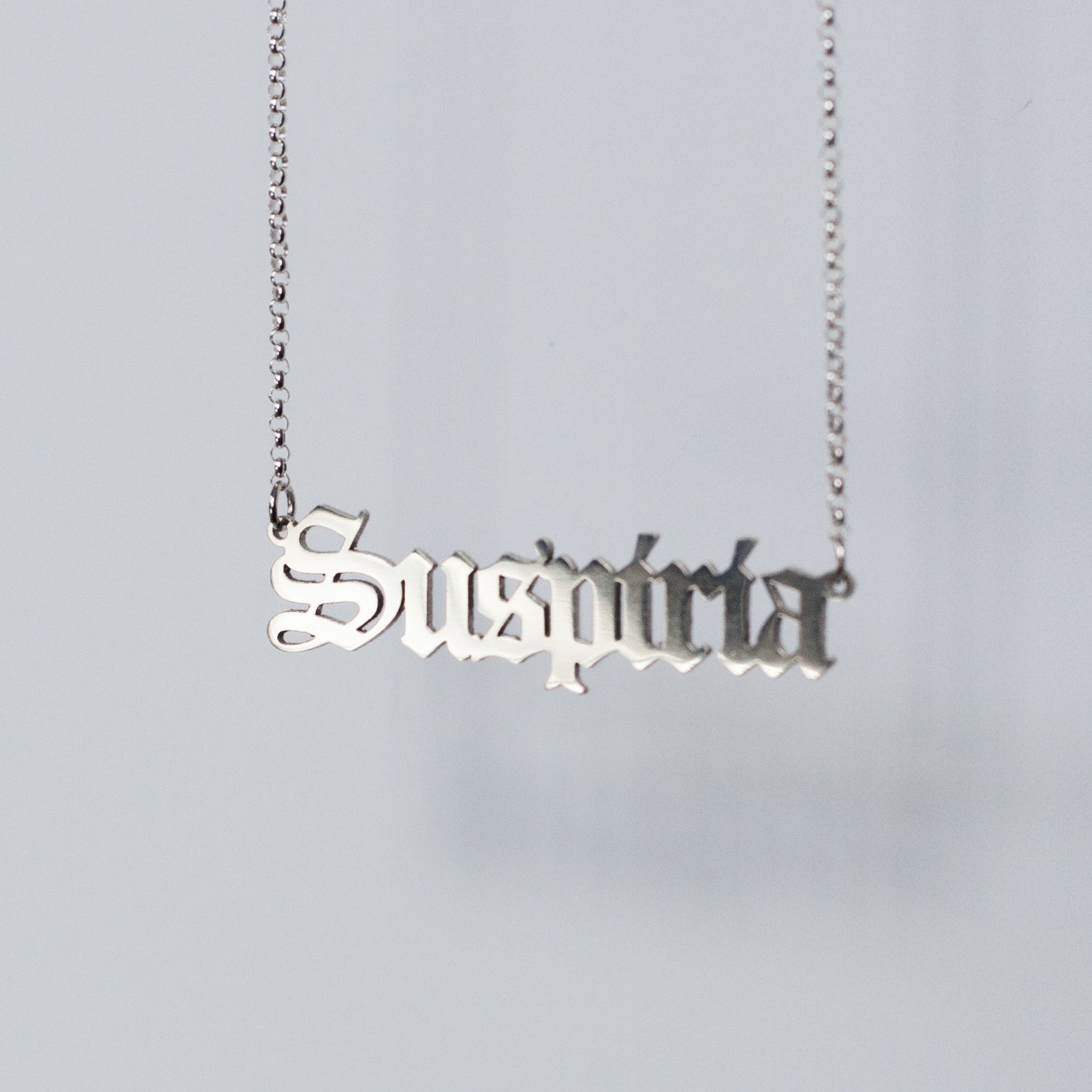 Suspiria Necklace in gothic blackletter font handmade in sterling silver. 