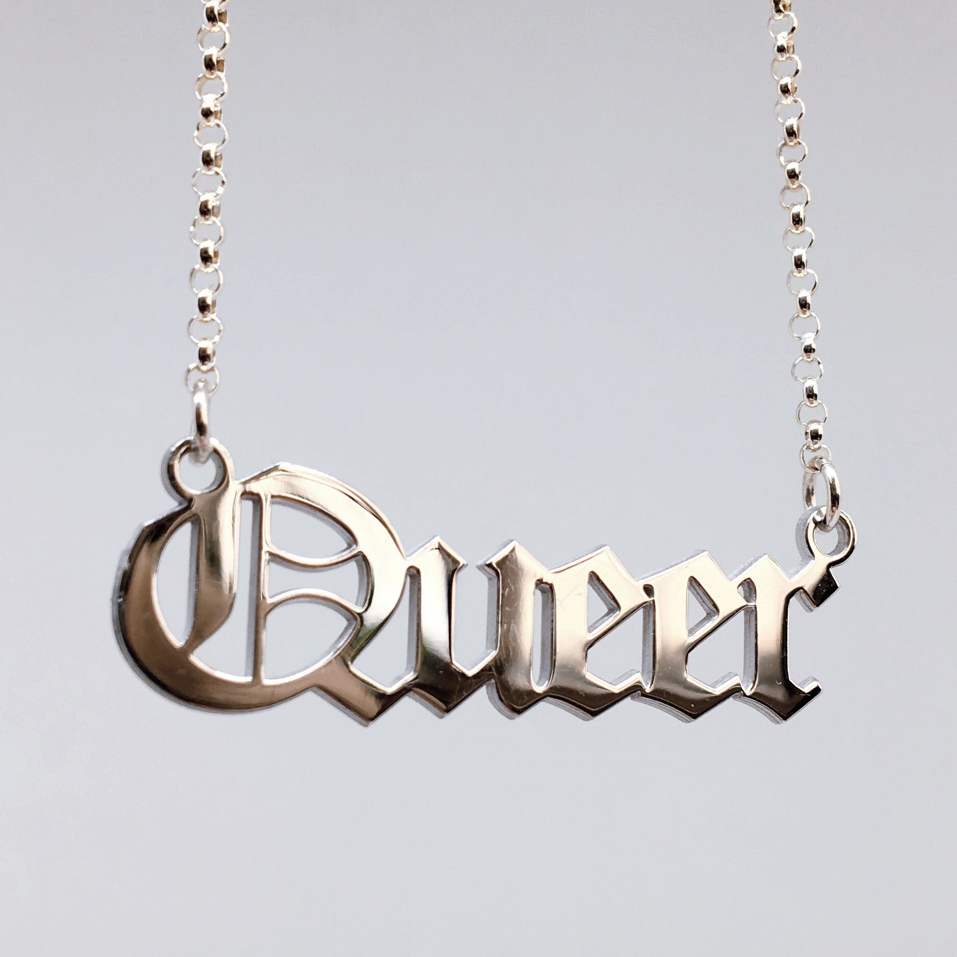 Queer blackletter nameplate necklace in sterling silver