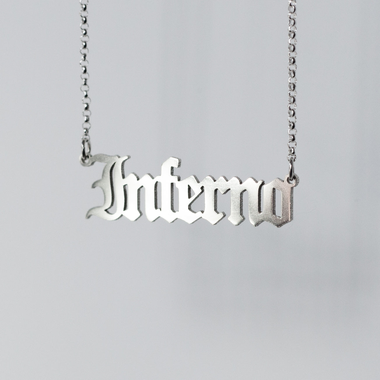 Sterling silver Inferno Necklace in gothic blackletter font.