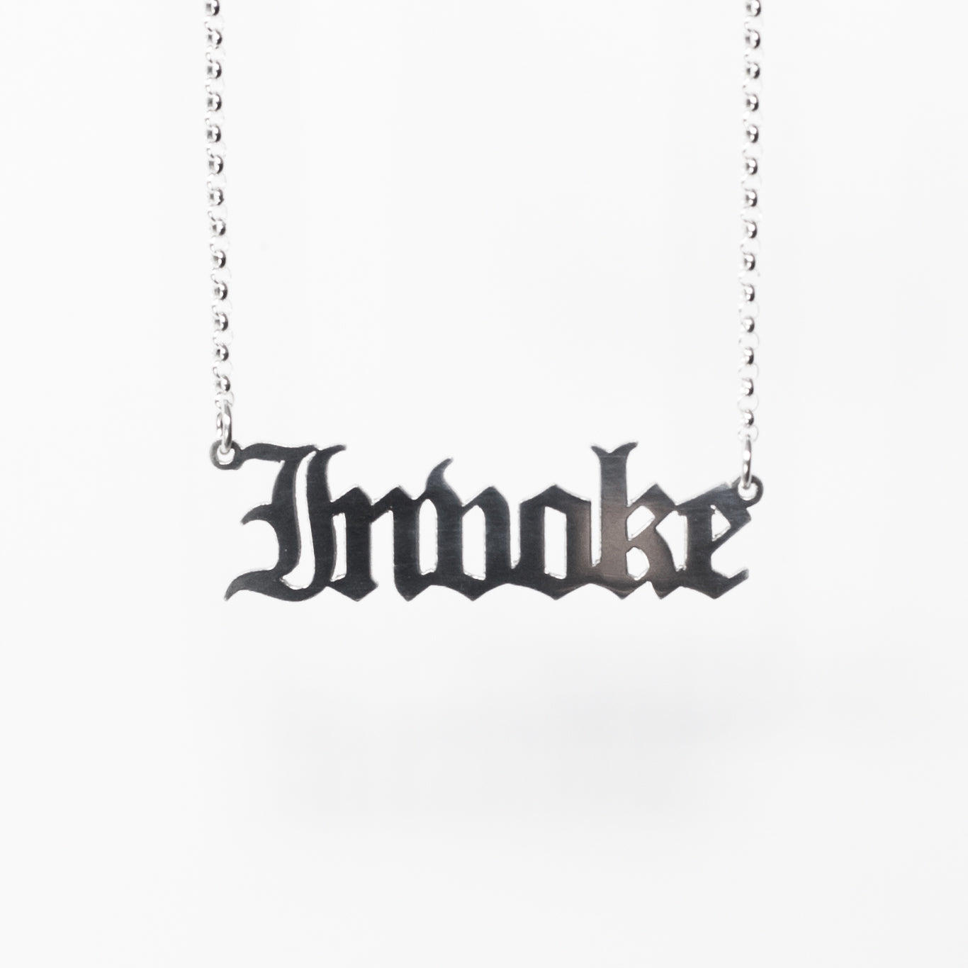 Invoke Necklace in gothic blackletter font. Handmade in sterling silver. 