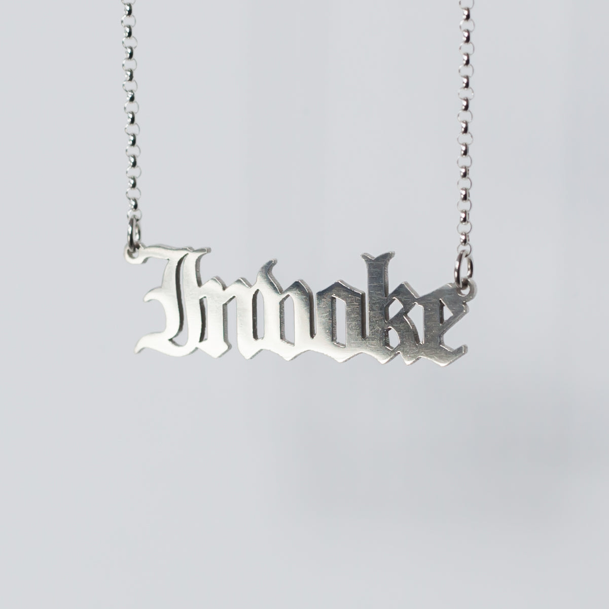 Invoke Necklace in gothic blackletter font. Handmade in sterling silver. 