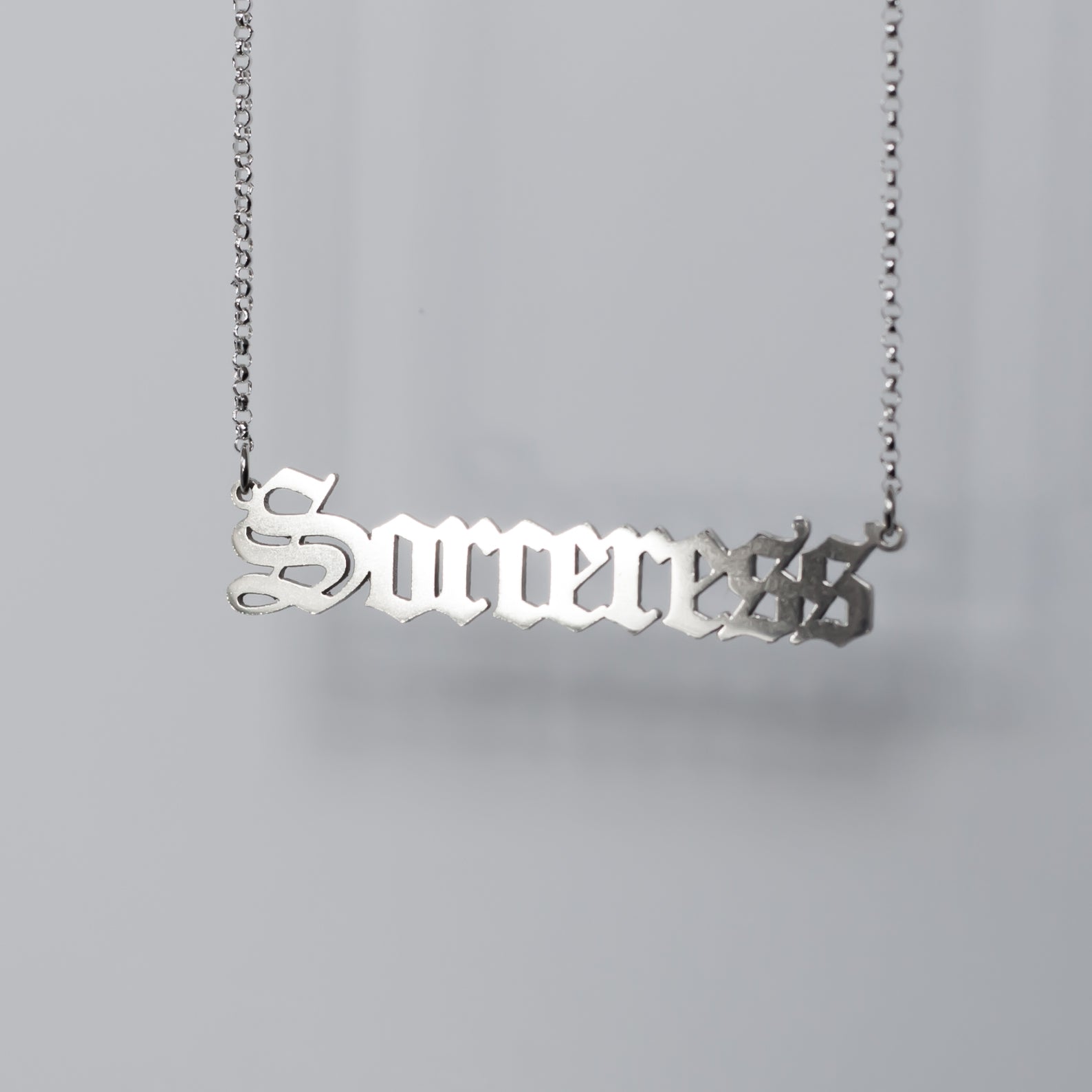 Sorceress Necklace in gothic blackletter font in sterling silver