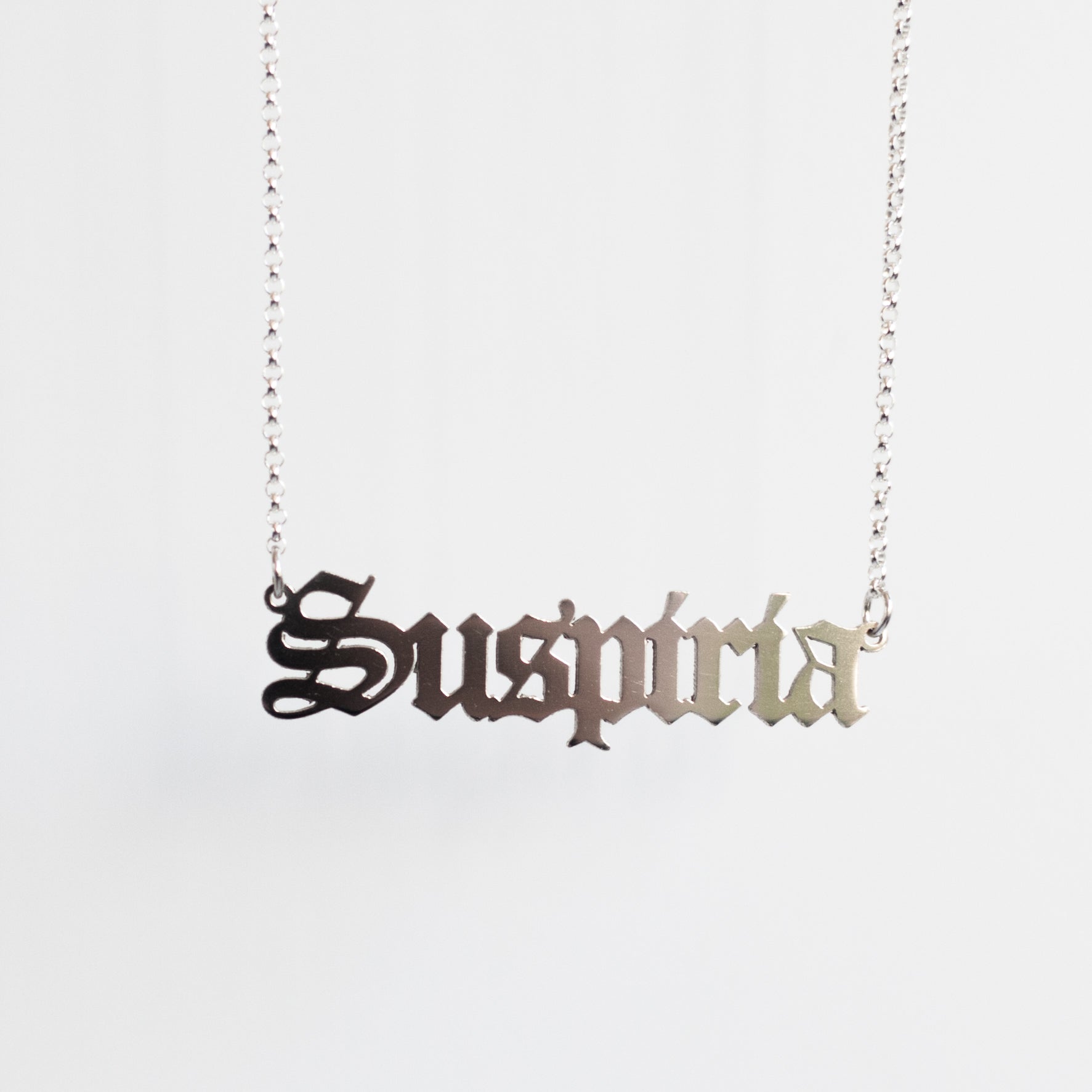 Suspiria Necklace in gothic blackletter font handmade in sterling silver. 