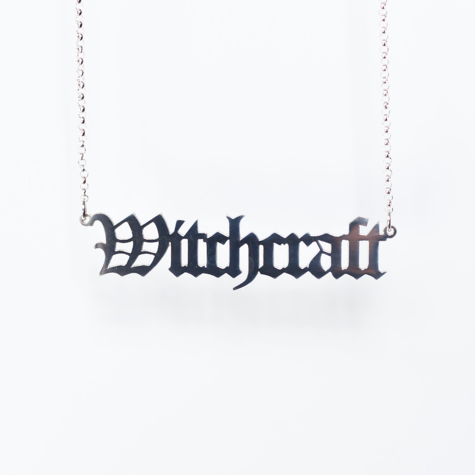 Witchcraft Necklace in gothic blackletter font in sterling silver