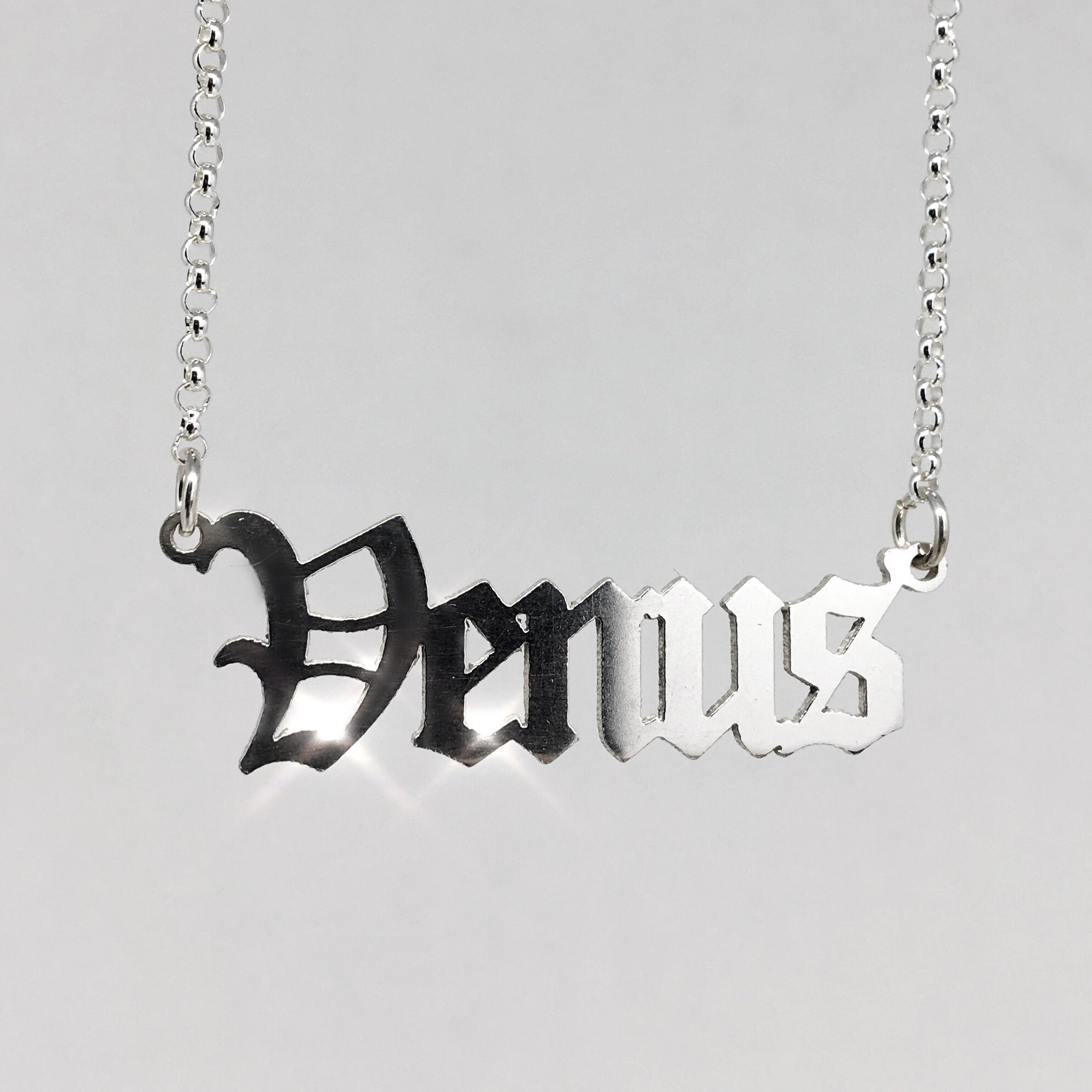 sterling silver Venus nameplate necklace in gothic blackletter font.