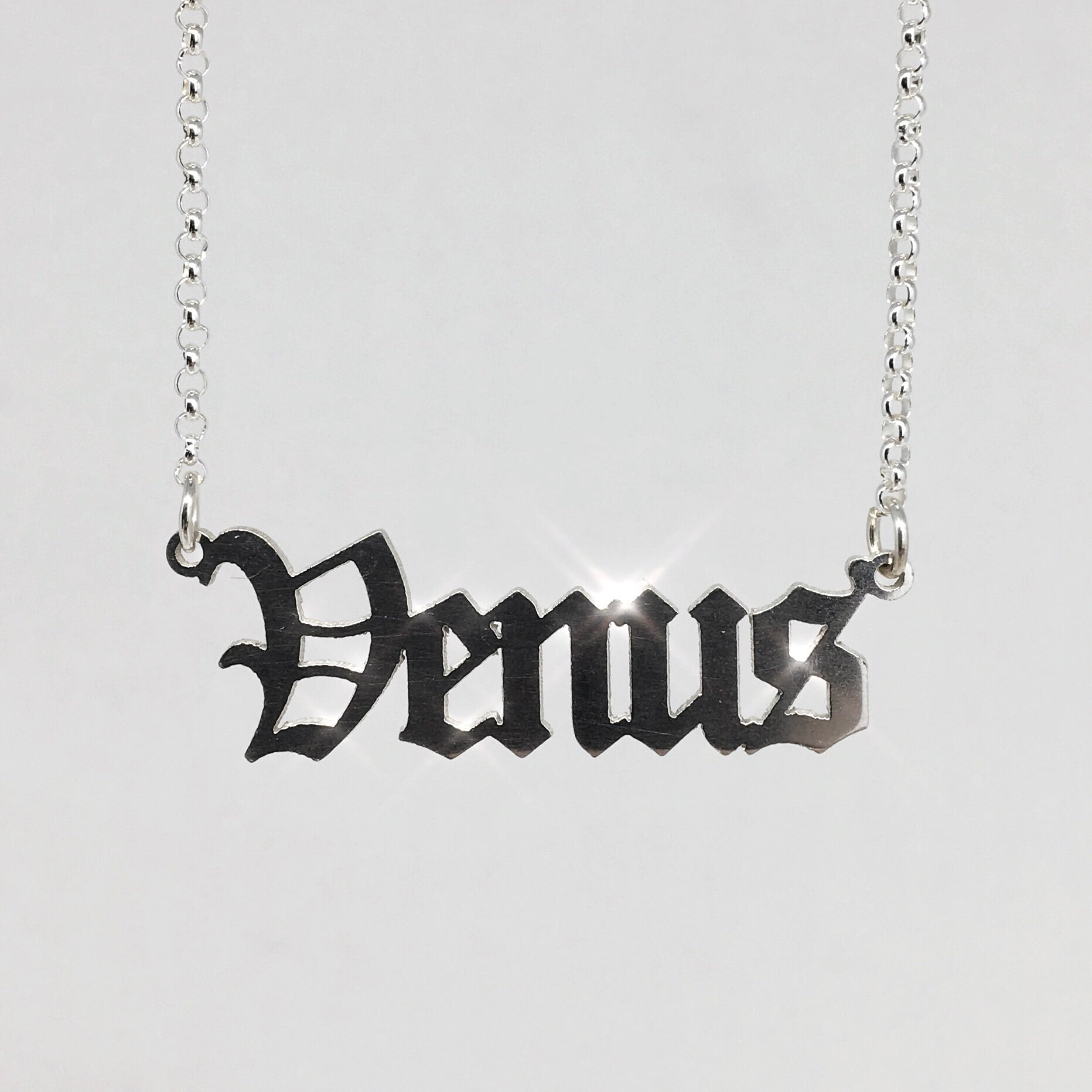 sterling silver Venus nameplate necklace in gothic blackletter font.