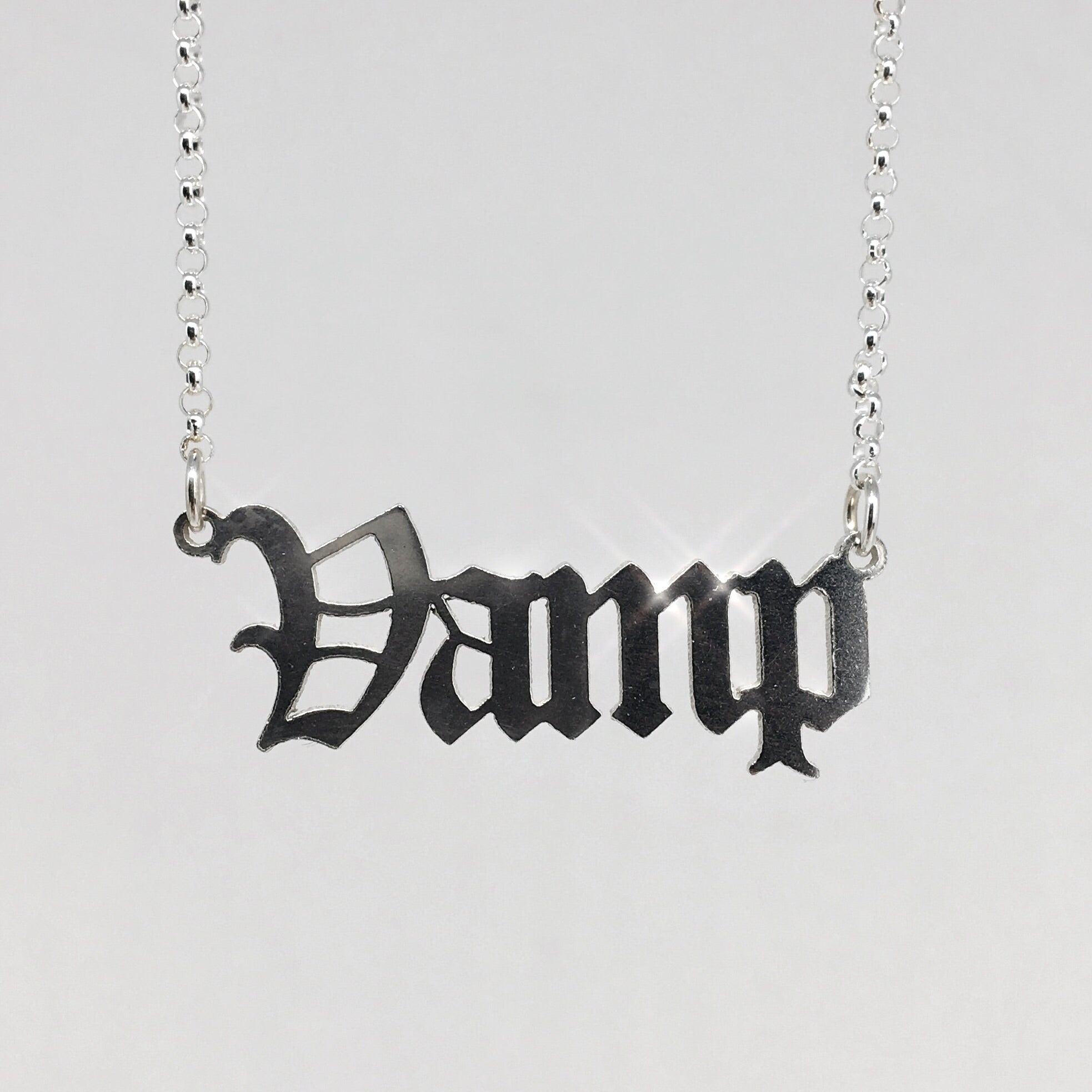 Sterling silver Vamp nameplate necklace in gothic blackletter font.