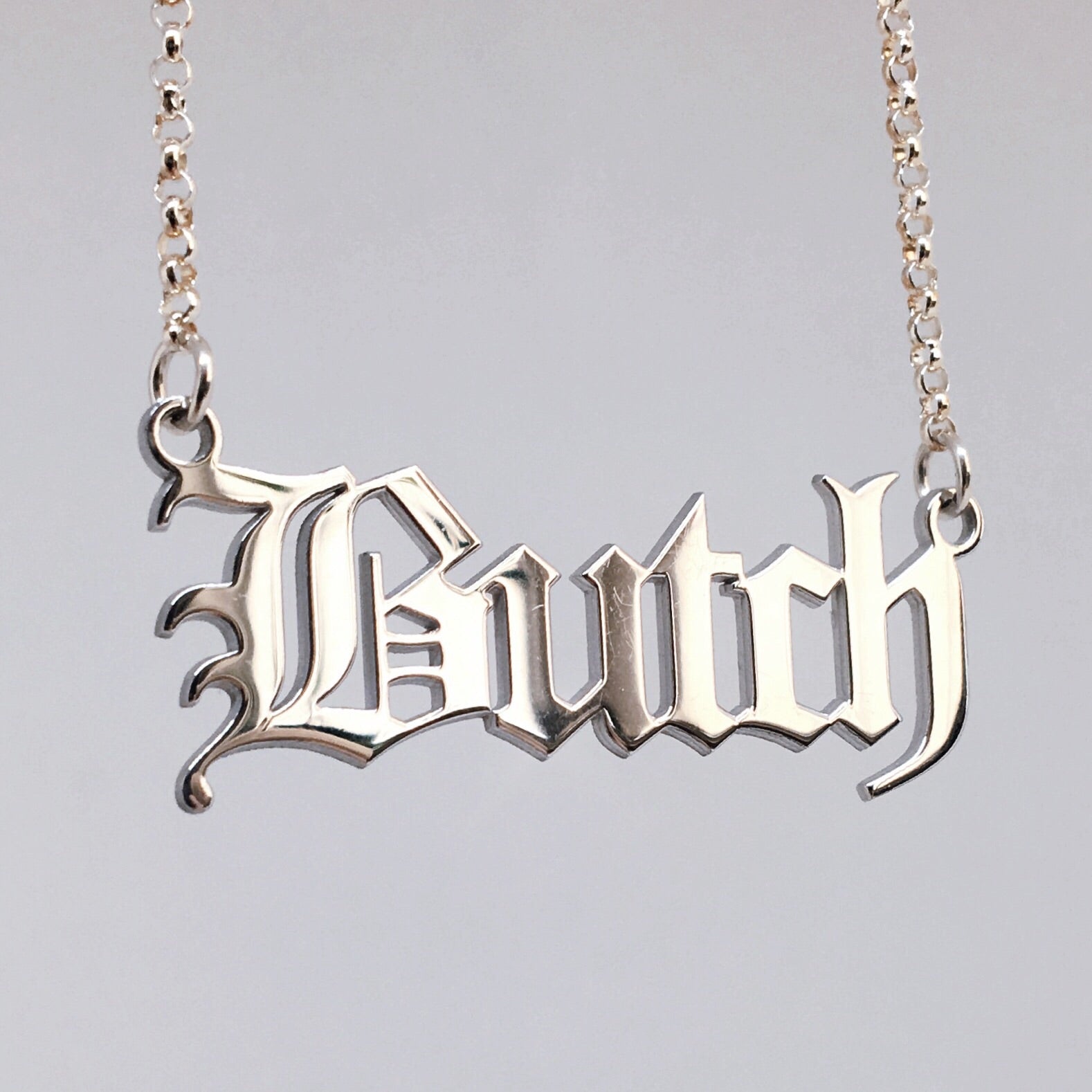 Gothic blackletter Butch necklace in solid sterling silver. 