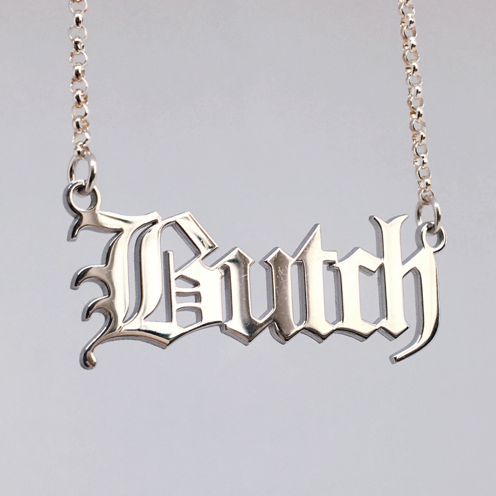 Gothic blackletter Butch necklace in solid sterling silver. 