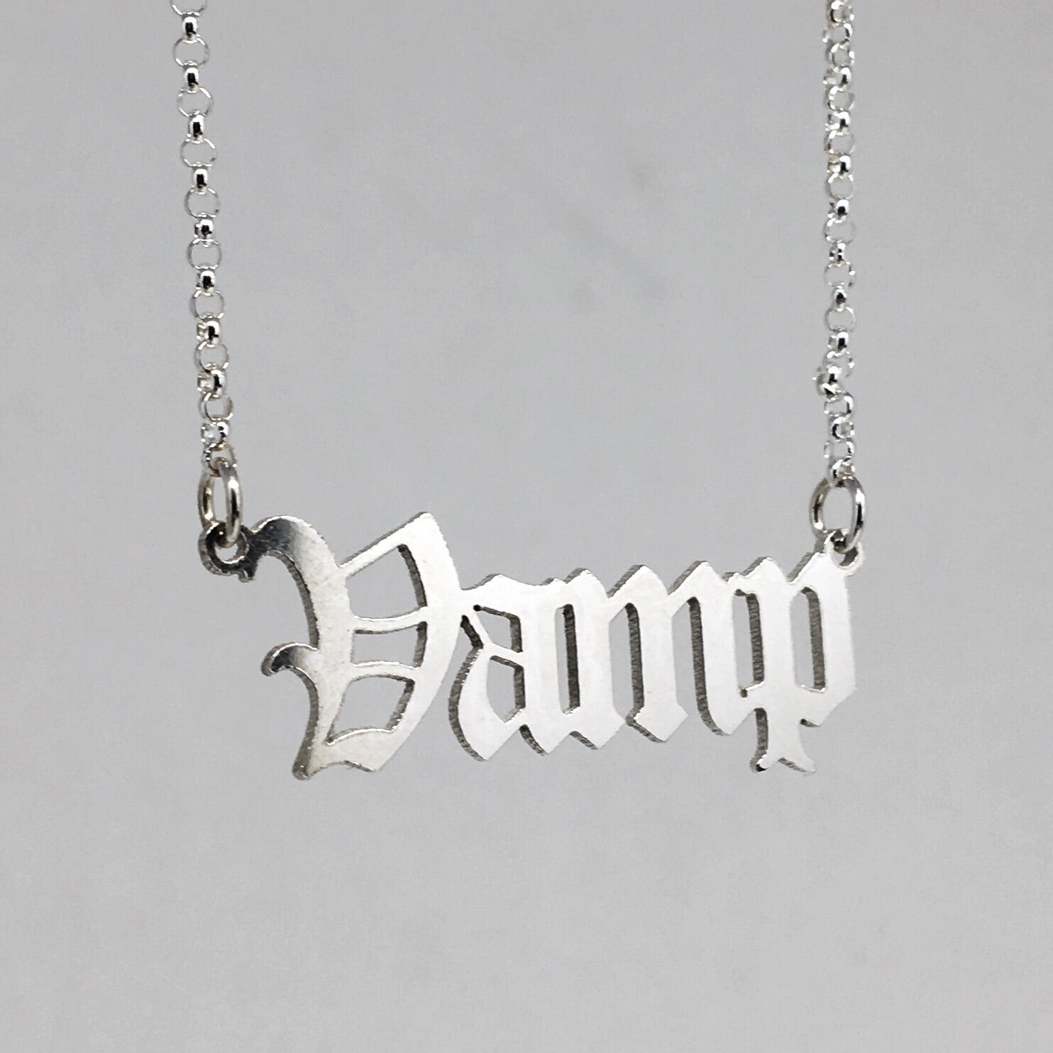 Sterling silver Vamp nameplate necklace in gothic blackletter font.
