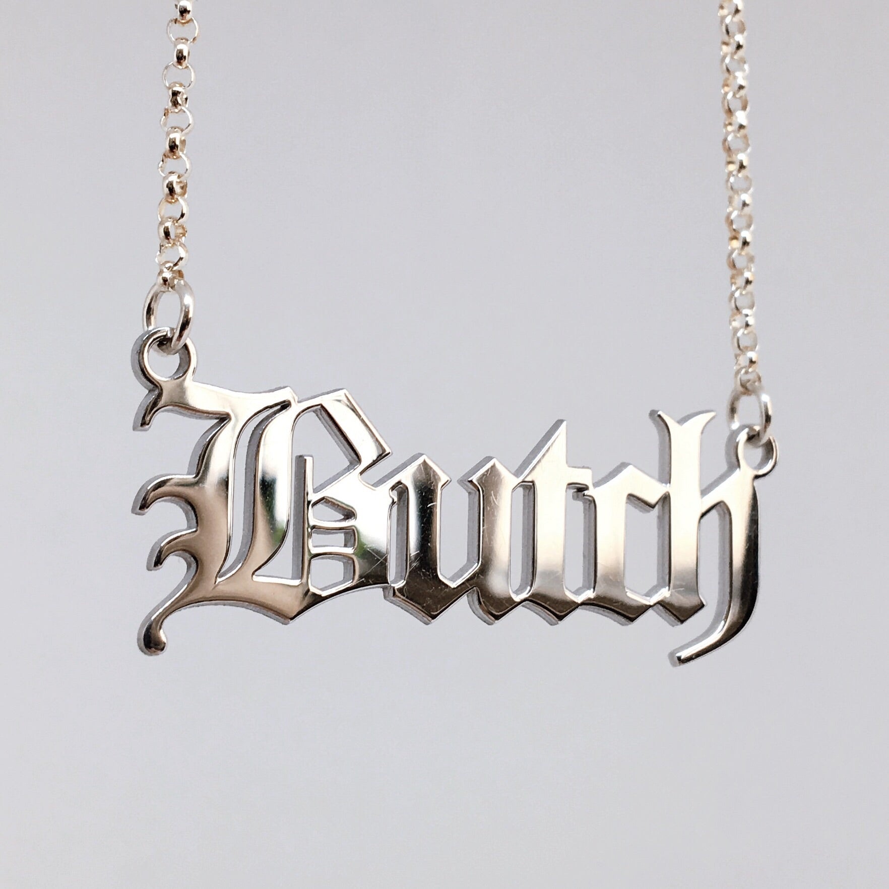 Gothic blackletter Butch necklace in solid sterling silver. 